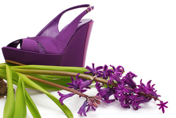 Purple platform shoe with flower close-up