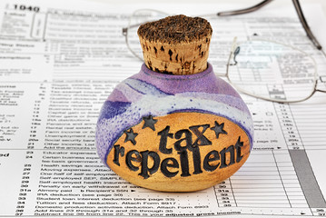 Corked bottle of tax repellent