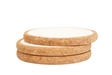 Three cork coaters stacked, isolated on white