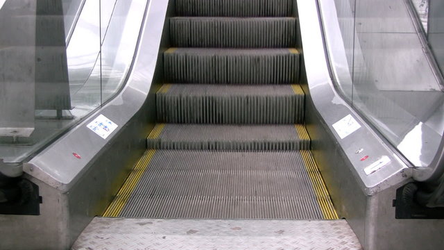 A close view of an escalator moving upwards