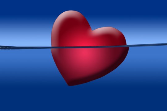 Red heart illustration shape sinking into the blue water