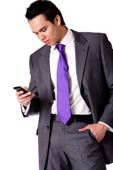 Strong young indonesian man in a suit checking his phone