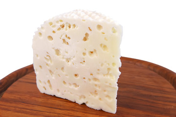 white goat hard cheese front view