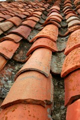 Aged old red clay arabic roof tiles