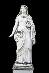 Statue on black background showing a greek mythical muse