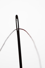 Threading a needle in silhouette