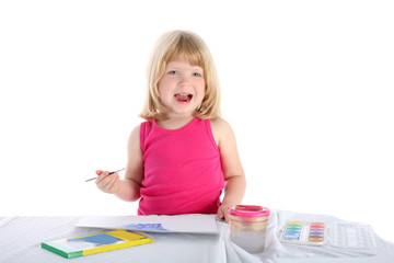 girl with paint beside table isolated on white