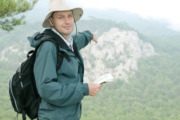 Hiker with map while out trekking