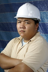 Serious asian construction engineer