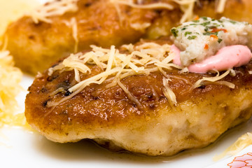 chops with the grated cheese on a dish