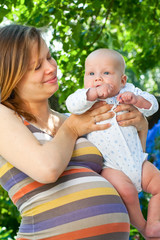 Pregnant woman with infant