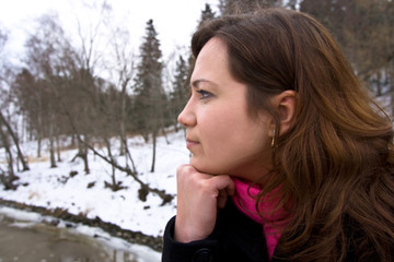 Young girl is dreaming outside