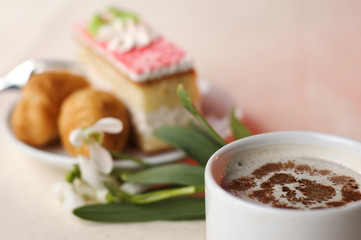 close-up cup of coffee with dessert