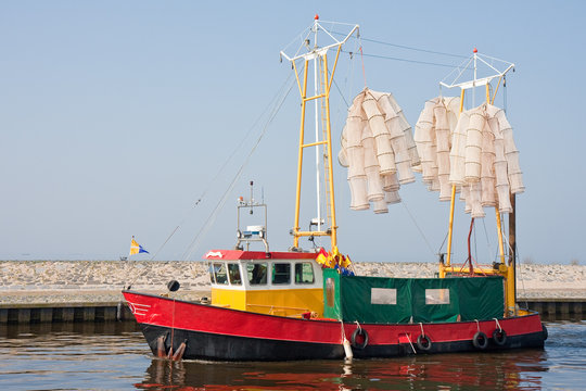Fishing ship sails to the sea