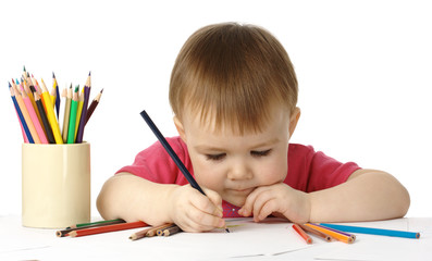 Child draw with crayons