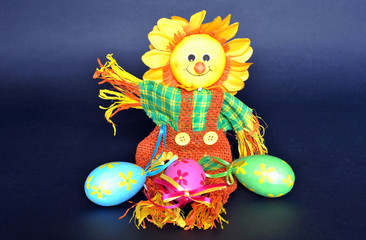 Fabric scarecrow with decorative Easter eggs