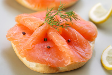 Smoked salmon on bagel with fresh black pepper.