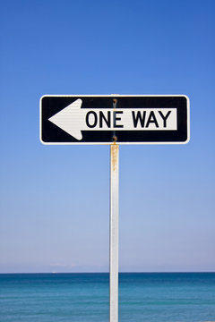 one way sign on the beach