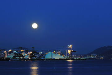 Industrial ship yard at Burrard inlet under moonlight