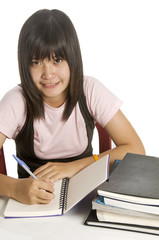 Student studying and writing