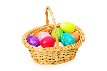 Easter concept with eggs and basket on white