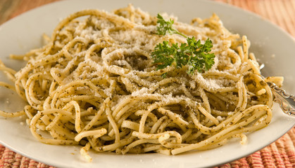 spaghetti with pesto and grated parmesan