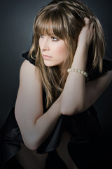 Naklejka premium Shot of a Beautiful Brunette Girl Looking Reflective