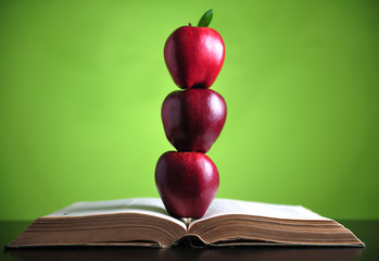 Apples on book