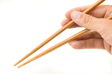 Hand holding chopsticks.