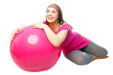 Fototapeta na wymiar happy pregnant woman with a fitness ball