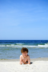 Boy playing on beach