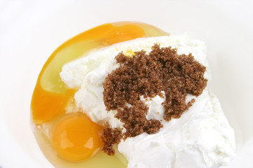 white cottage cheese, broken egg and sugar