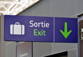 Bilingual english-french exit sign at international airport