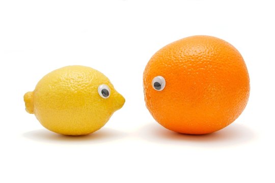 Funny Lemon And Orange With Eyes Isolated