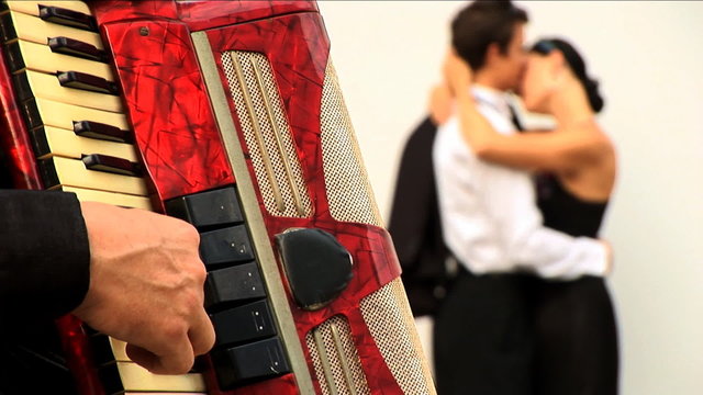 Accordion Player With Romantic Couple