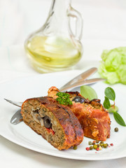 sliced fillet meat - stuffed black olives and mushrooms