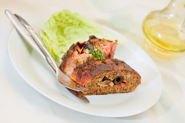 sliced fillet meat - stuffed black olives and mushrooms