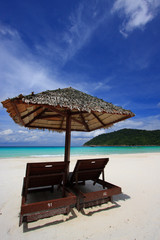 Chairs on a beautiful tropical island beach - 13267809