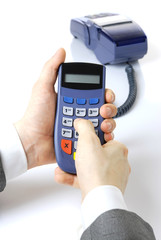 Pinpad in hands at the businessman.