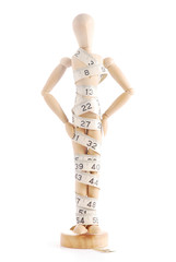 Artists mannequin with measuring tape