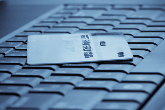 Macro close-up of credit card on laptop's keyboard