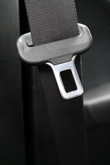 Black seatbelt in a small car