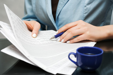 Businesswoman working with financial reports.