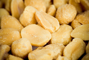 Background of close-up of fried salted peanuts