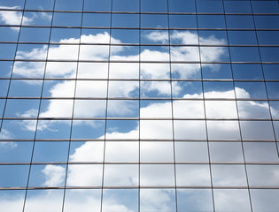 cloud and sky reflection on glass building.