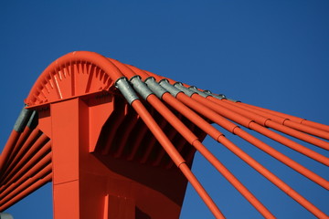 orange pylon of bridge