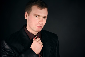 young man on a black background