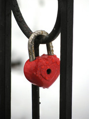 Red heart lock with the drops of rain