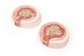 Belly pork and stuffing on a white studio background.
