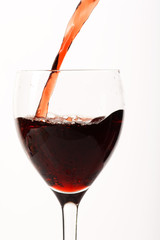 .Red wine poured in a glass